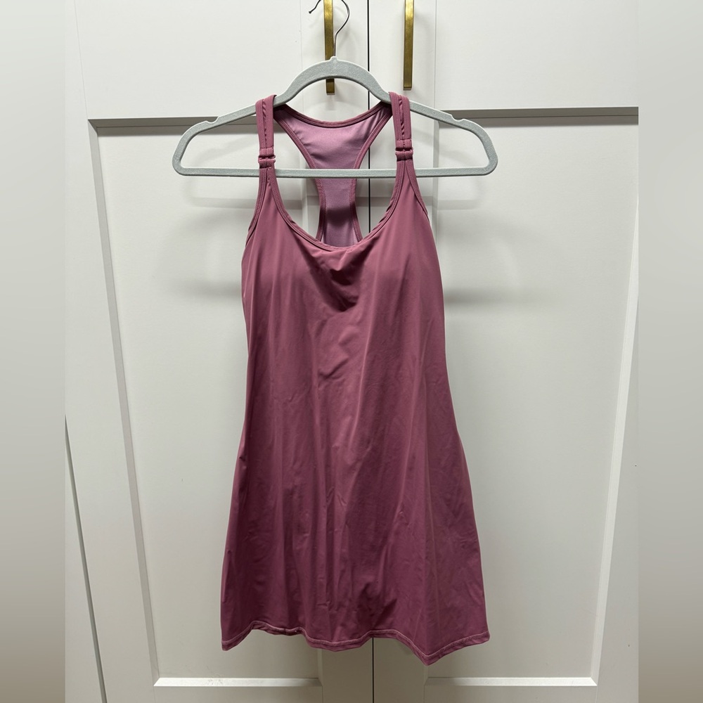 Athletic dress with shorts. Pinkish mauve color.